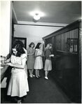 Lindenwood Students Waiting in Line at the Campus Bank in Roemer Hall, circa 1940 by Lindenwood College