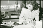 Lindenwood College Student with a Cat Dissection, circa 1970 by Lindenwood College